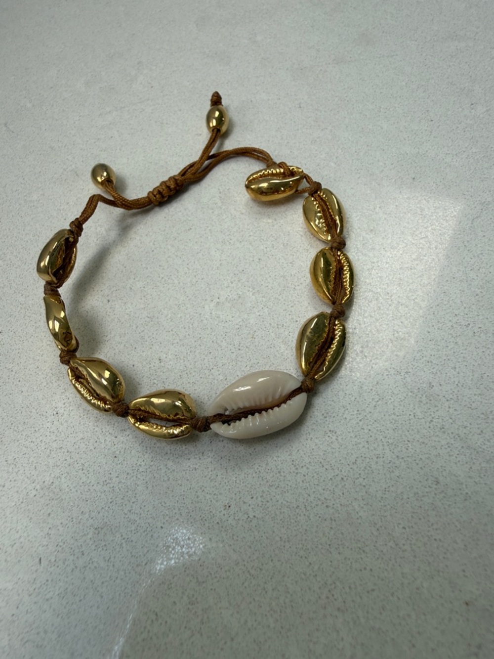 TOHUM Gold plated and White Cowrie Shell Beaded Bracelet - Adjustable.